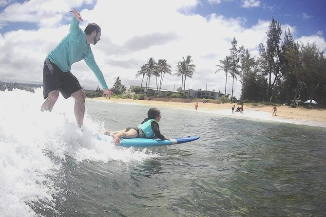 Group Surf Lessons for beginners on the North Shore of Oahu - Dry-land warm-up: pop-up practice that makes the first ride realistic