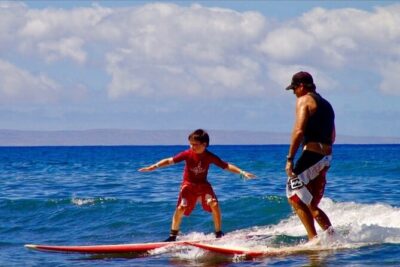 Surfing Waikiki with local Firefighters - Getting there: Duke Paoa Kahanamoku Statue and the grey Tacoma pickup